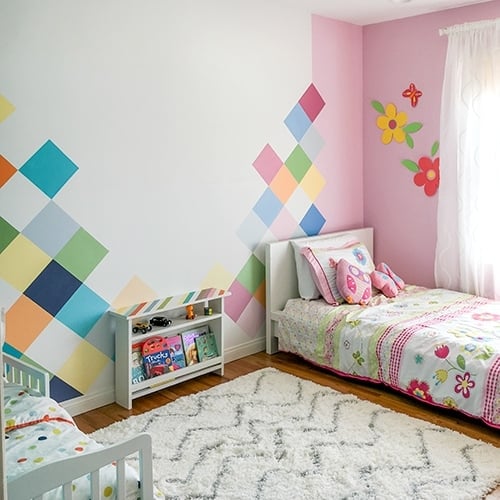 A colorful boy-girl shared bedroom to blow your mind! Bring each kids personality into the room and make it work together!