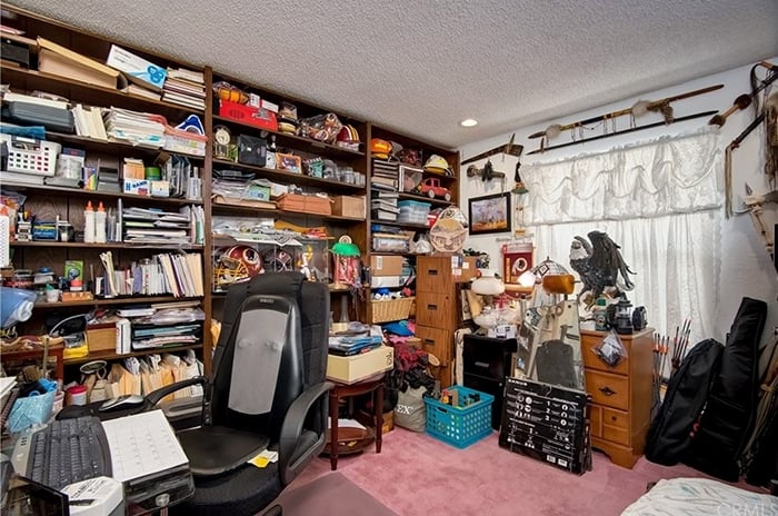 Messy room before makeover into kids room
