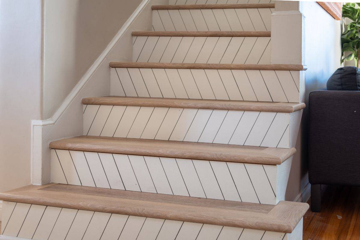 Staircase makeover ideas with wood plank flooring