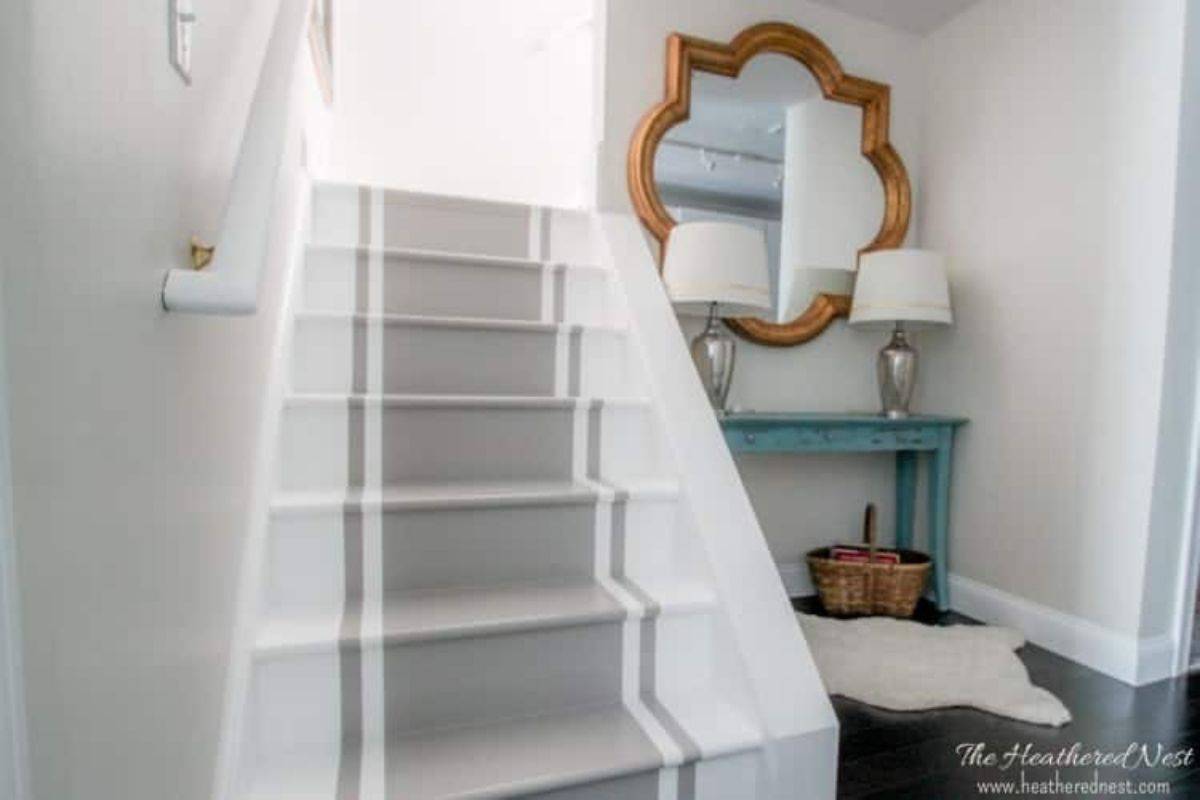 staircase with a painted rug runner