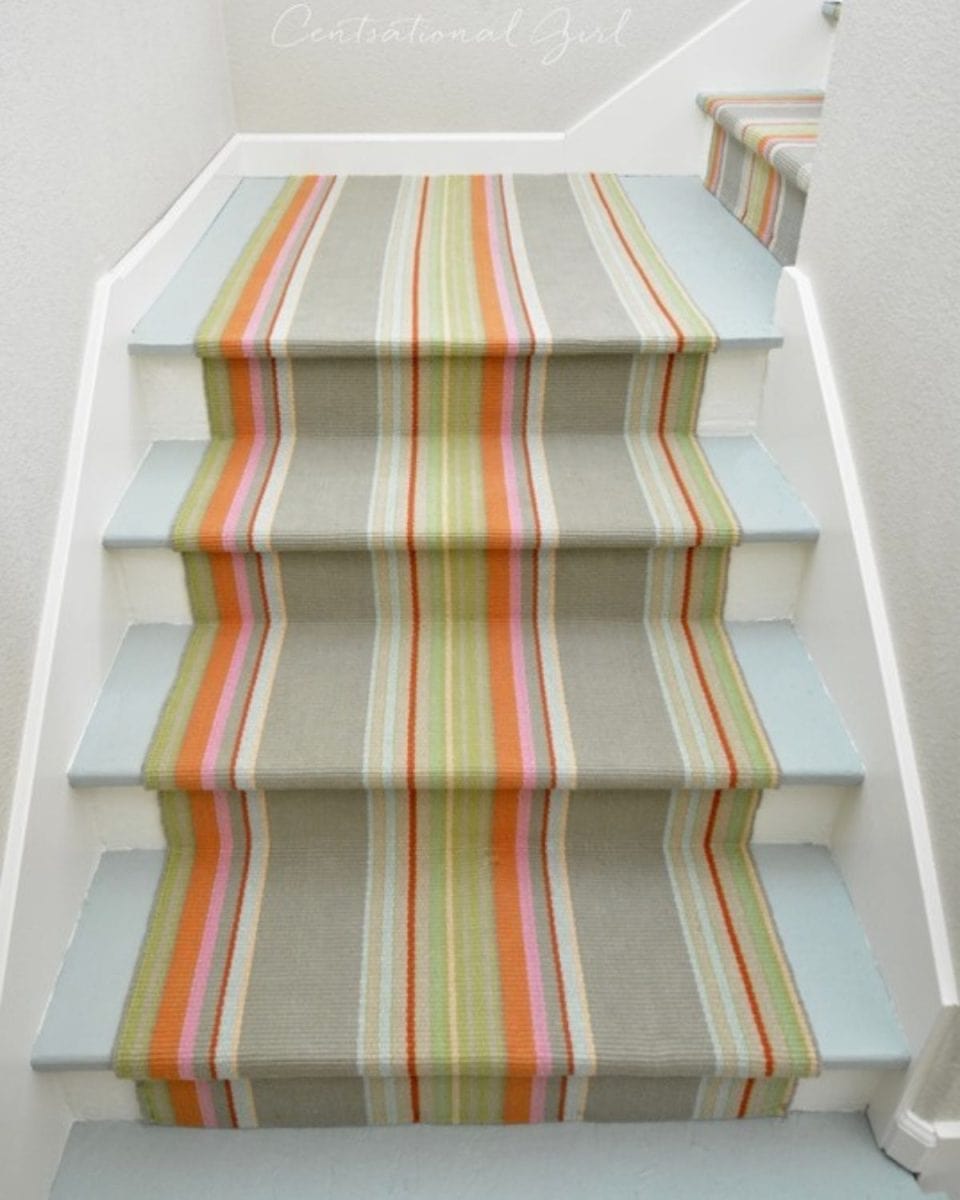 Colorful rug runner on painted stairs