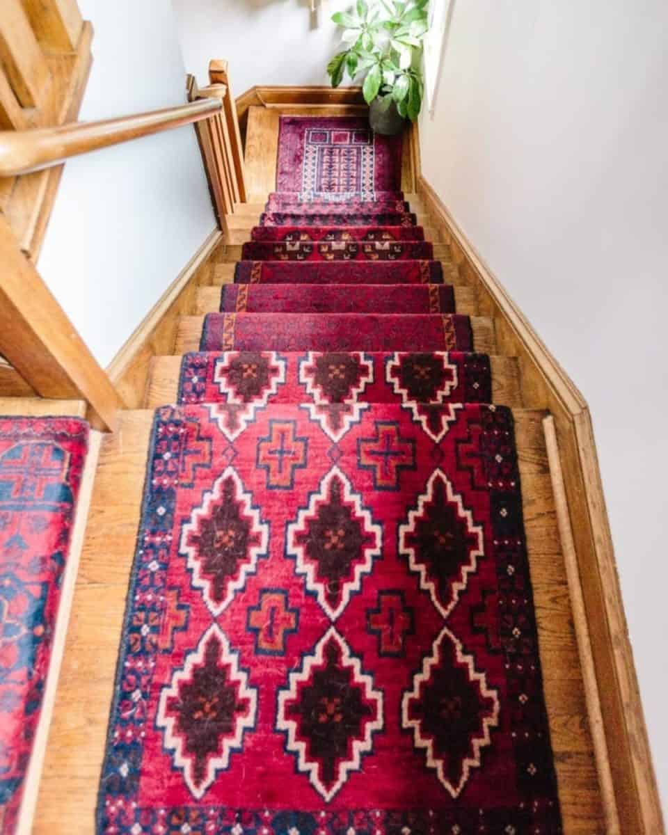 Staircase makeover idea using vintage rugs as a runner