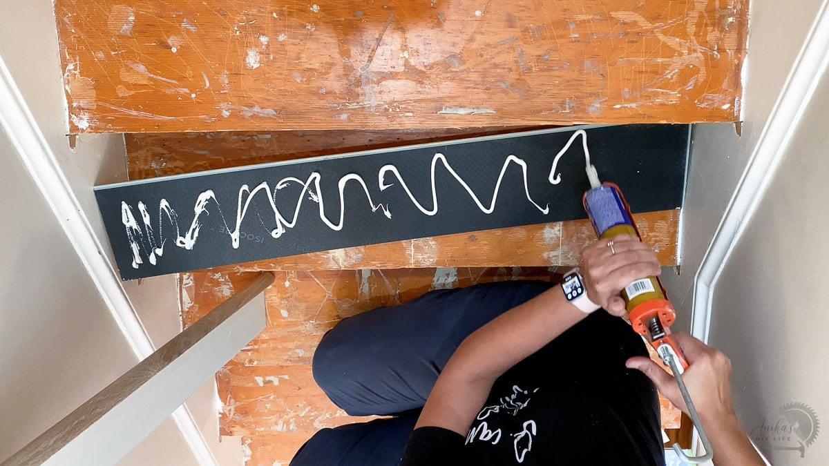 Applying liquid nails to stairs