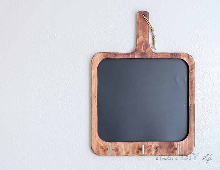 Final finished blank cutting board shaped magnetic chalkboard on the wall