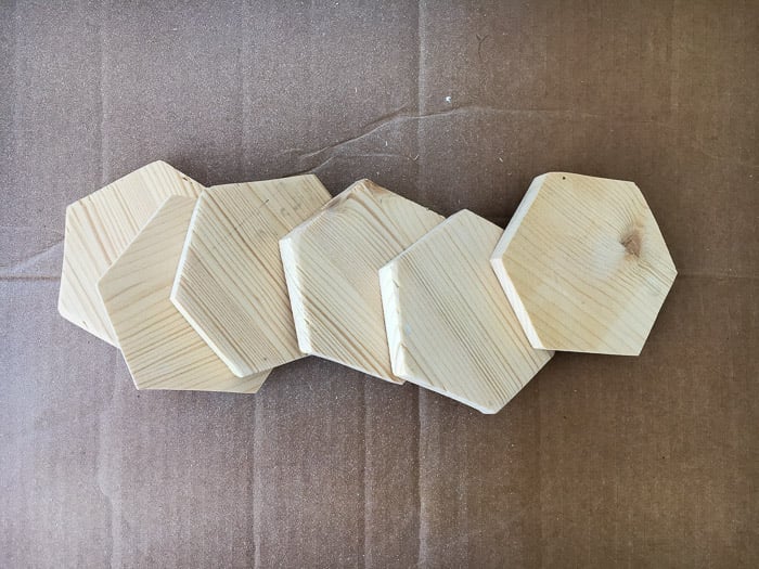 six wood hexagons cut and sanded for the DIY hexagonal marble and gold coasters