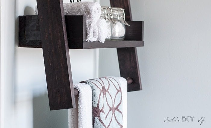 Floating ladder shelf with towel bar.
