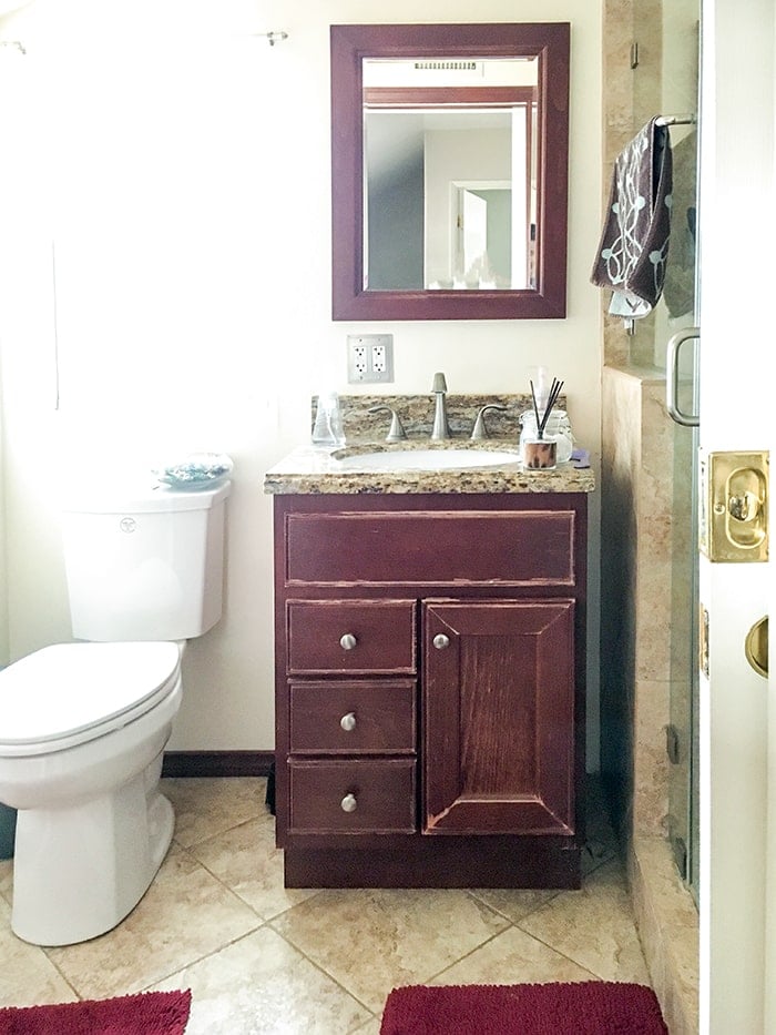 small bathroom remodel before view - brown cabinets.