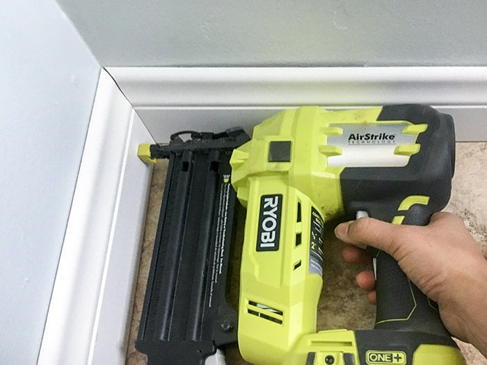 Installing baseboards using a nail gun