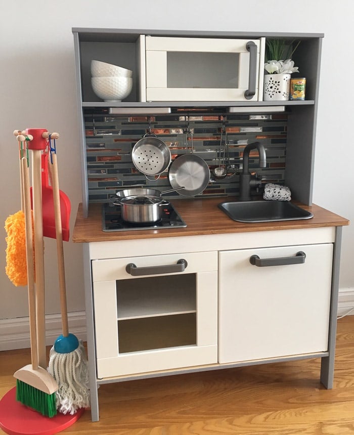 Peel and stick tile to update the Ikea play kitchen