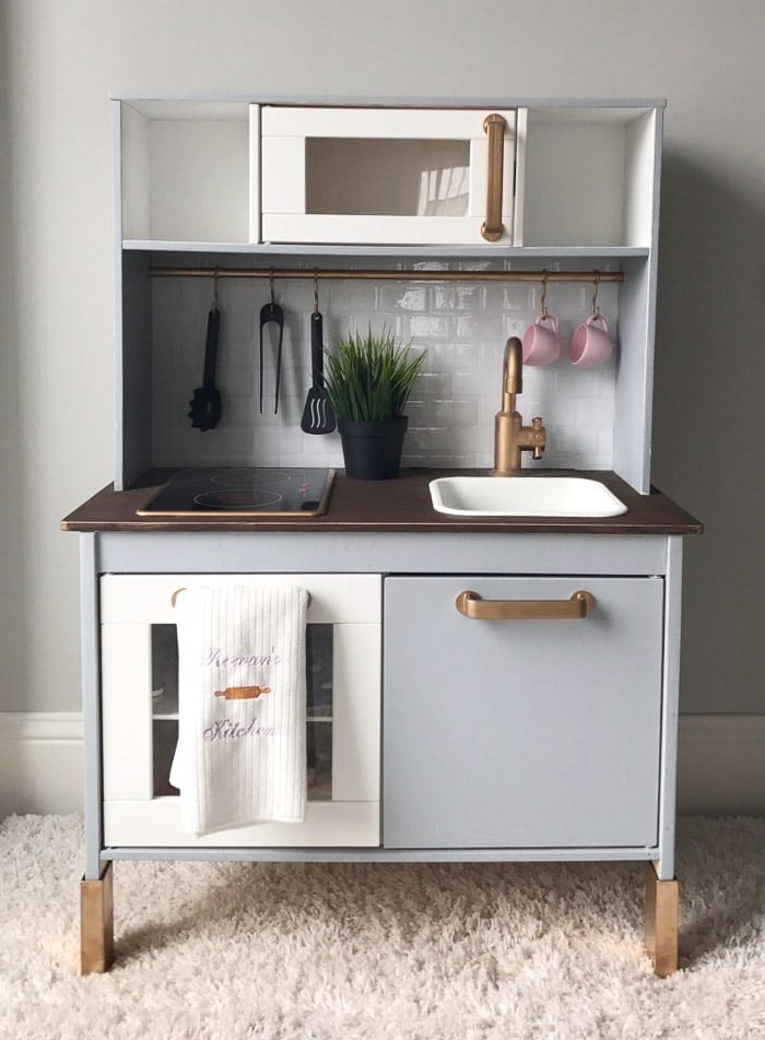 Copper and blue Ikea play kicthen upgrade using peel ad stick subway tile