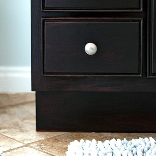 Learn how to use gel stain to easily update cabinets without any heavy sanding or stripping. The step-by-step tutorial and video show you how to update outdated cabinets quickly with this affordable idea.