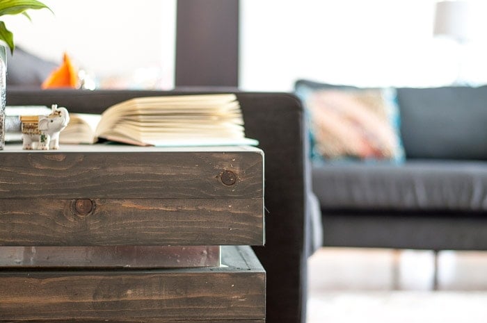 Close up view of DIY tiered end table with metallic accents