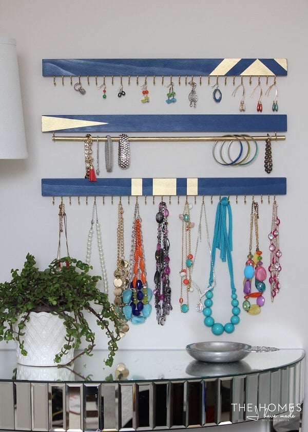 blue and gold 1x2s with cup hooks for DIY wall jewelry organization