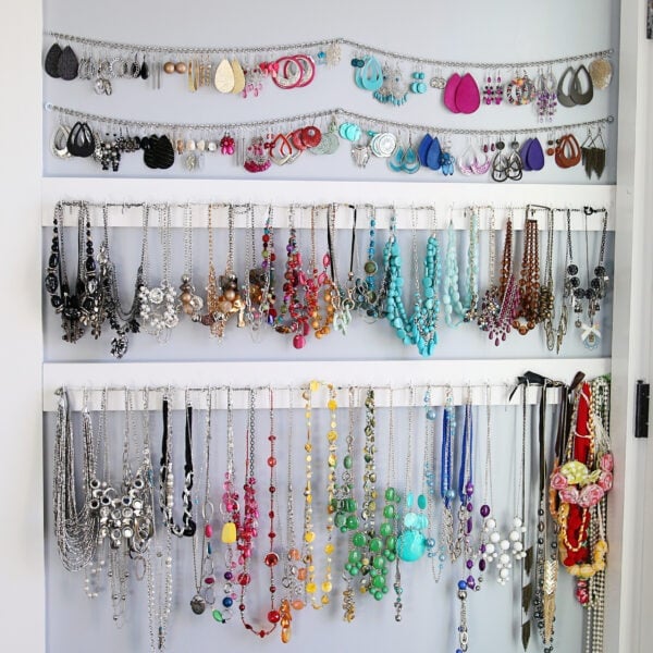 4 rows of jewelry hanging on the wall