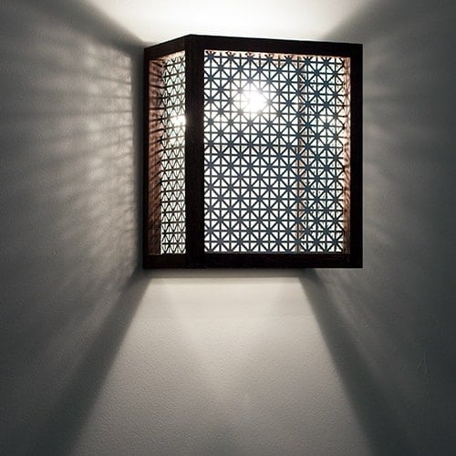 How to make a wall sconce using a simple wood dowel and decorative metallic sheet. This step by step tutorial with video shows you how to add an easy DIY wall sconce to your room. It can be used as an industrial wall sconce shade or a plugin wall sconce.