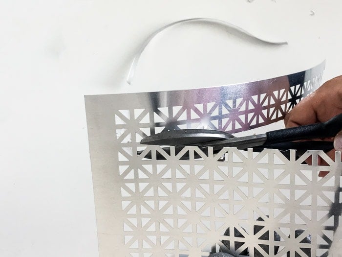 Cutting a metal sheet to make a DIY wood and metal sconce