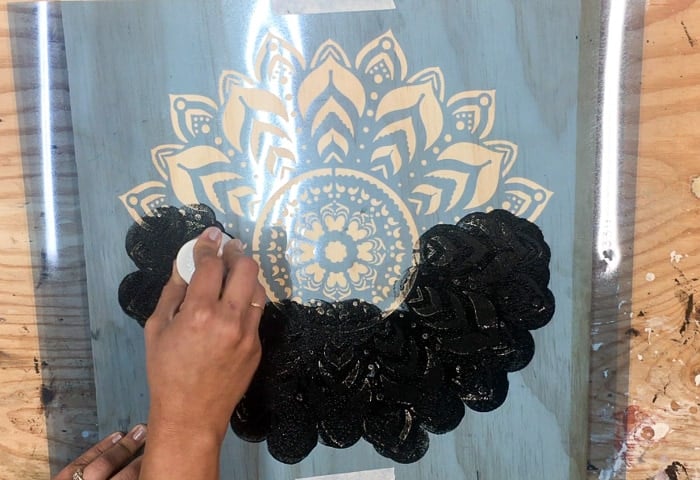 Transfering mandala onto plywood using a stencil - engraved wood wall art