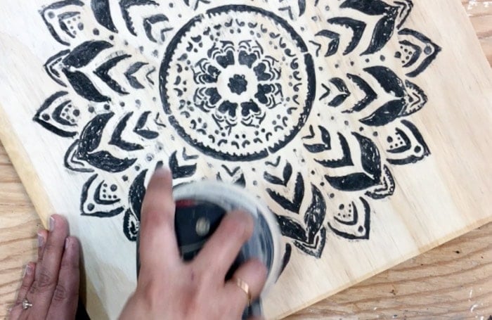 Dremel Wood carving - sanding the carved design to reveal engraved design.