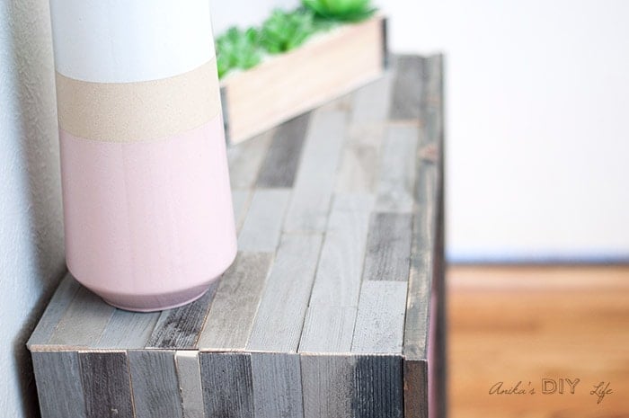 close up of corner of weathered barn wood wood bookshelf