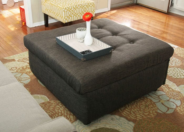Turn an old coffee table into a storage ottoman