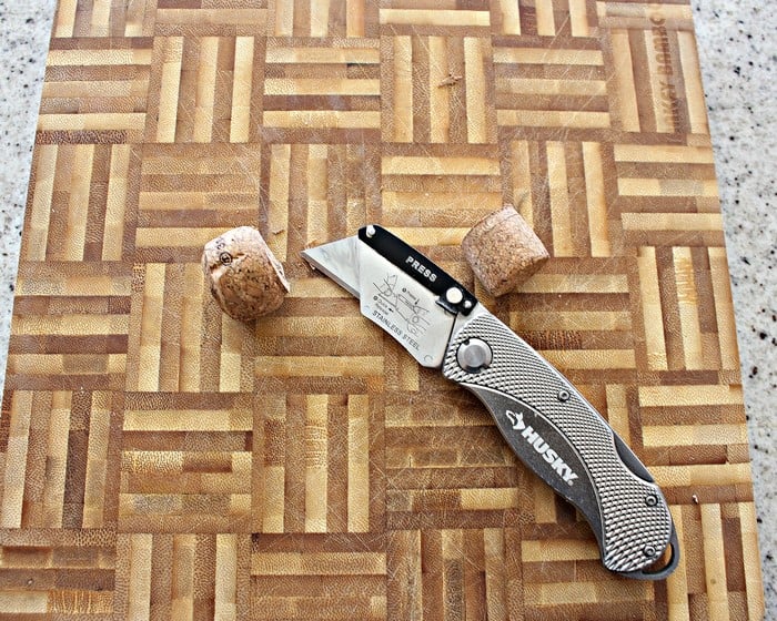 Cut champagne cork for a DIY curtain rod finial