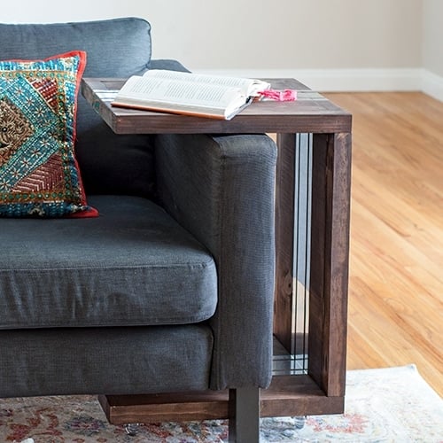 This DIY C-Table makes a perfect addition to any living room. The C shaped table makes it versatile and can be used in so many ways! Add mirror accents to the table to give it a modern touch using a simple trick!