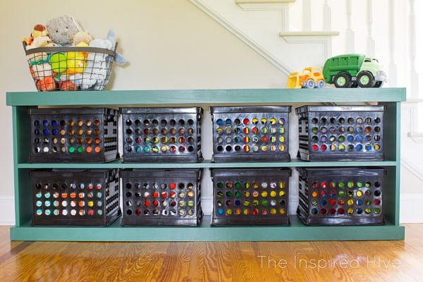 Green DIY toy storage using plastic bins