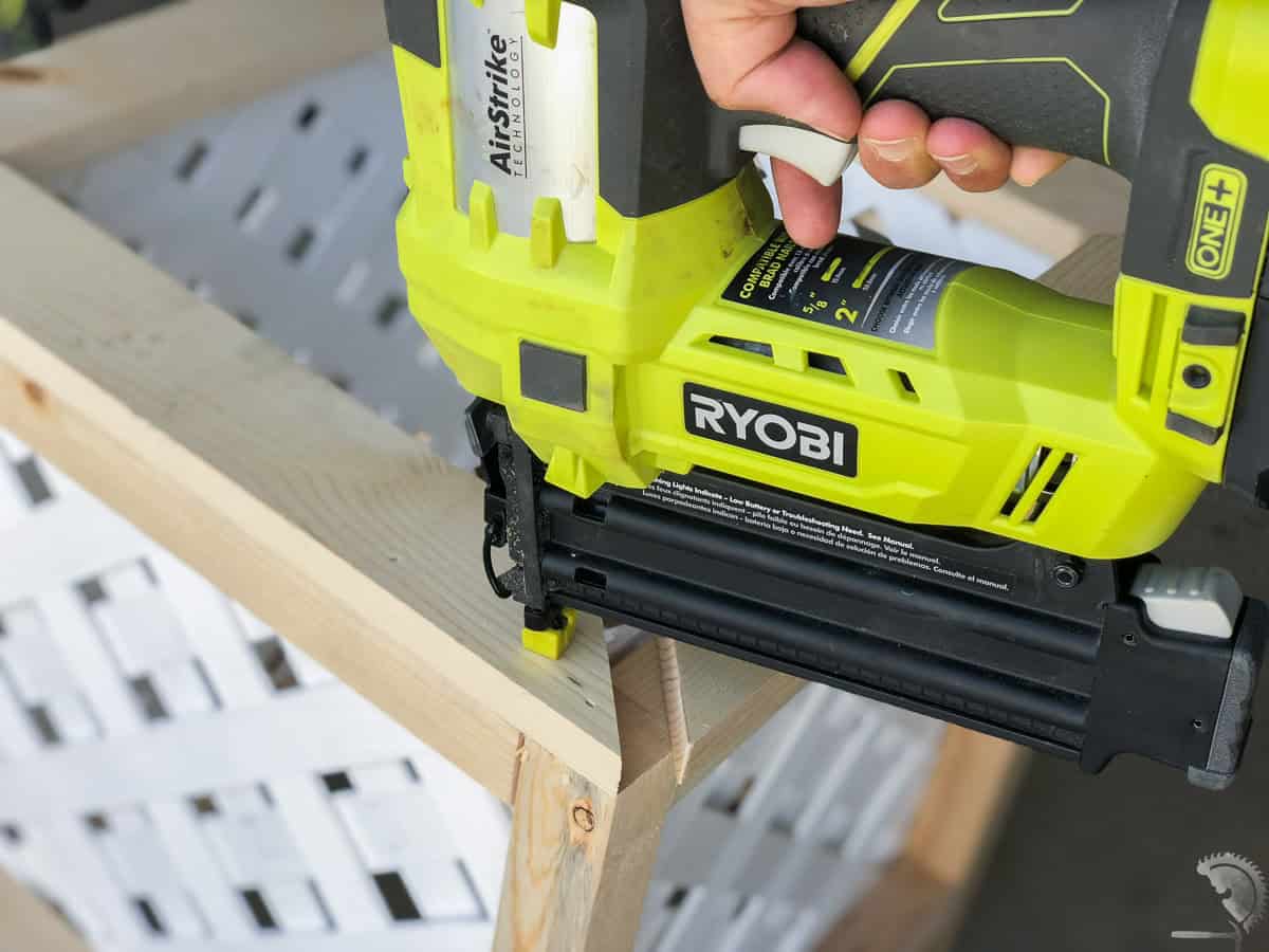 Attaching the top trim of the planter using a nail gun