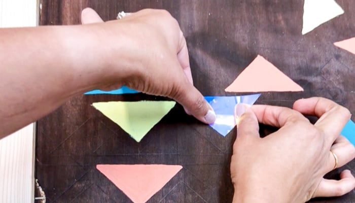 Adding white Mirror Tape to DIY wood wall art.