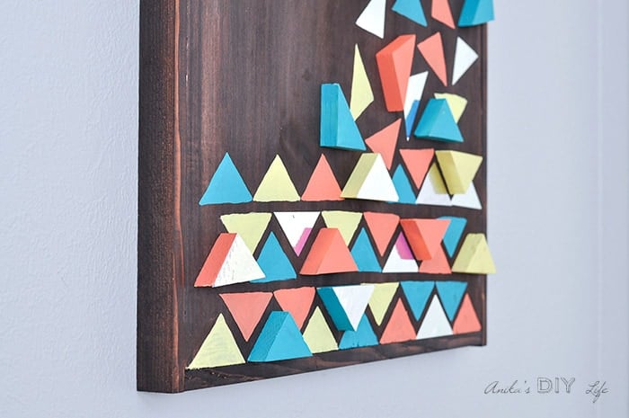 DIY wood wall art with 3 dimensional colorful triangles