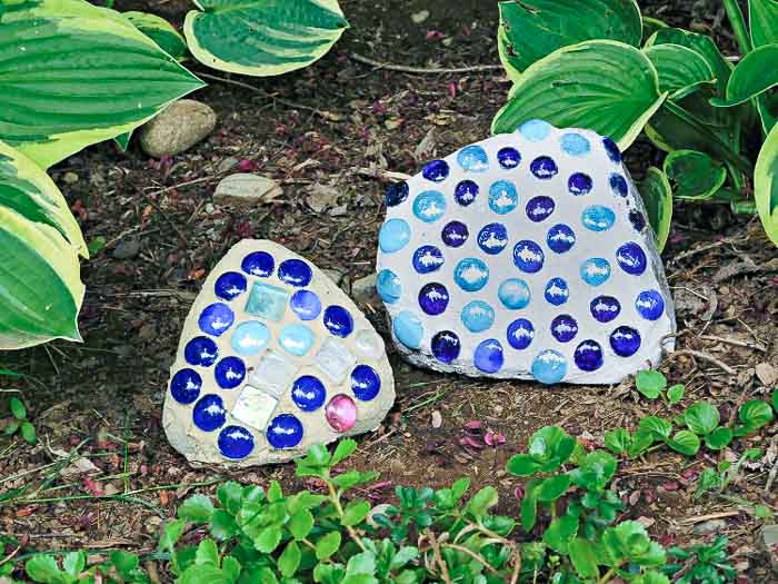 Blue and navy mosaic rocks in the garden.