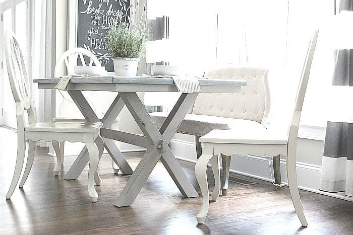 DIY Farmhouse table with X-base and white chairs