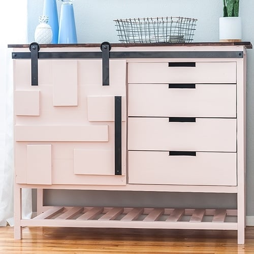 How to build your own multifunctional DIY sliding barn door cabinet with drawers. It adds the perfect storage to any room. Includes DIY barn door hardware.