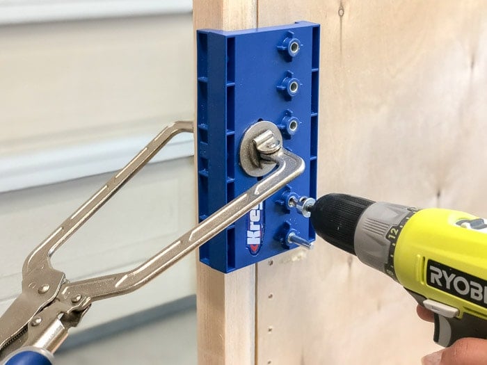 Using a shelf pin jig to make shelf pin holes for the cabinet