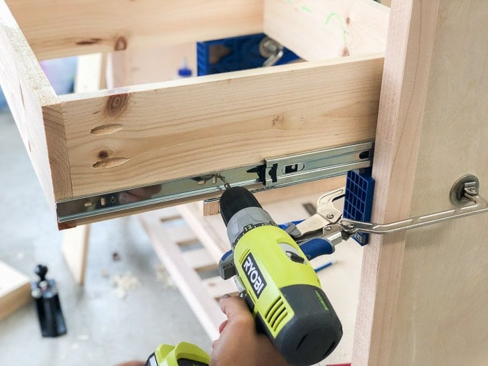 Attaching the drawer to the drawer slides using the Kreg drawer slide jig. Great review!