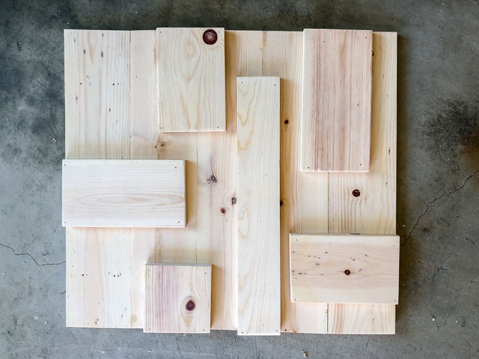 Adding scraps to the barn door to make it modern and 3-D