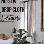 Drop Cloth curtains in the bathroom with text overlay.