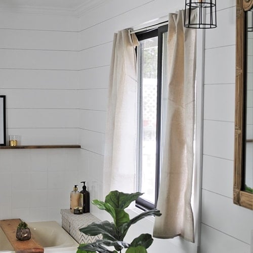 Make no-sew drop cloth curtains with this easy step by step tutorial. Transform your home on a budget with this easy and quick DIY home decor project.