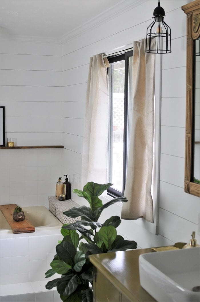 Full view of the no-sew drop cloth curtain in the bathroom