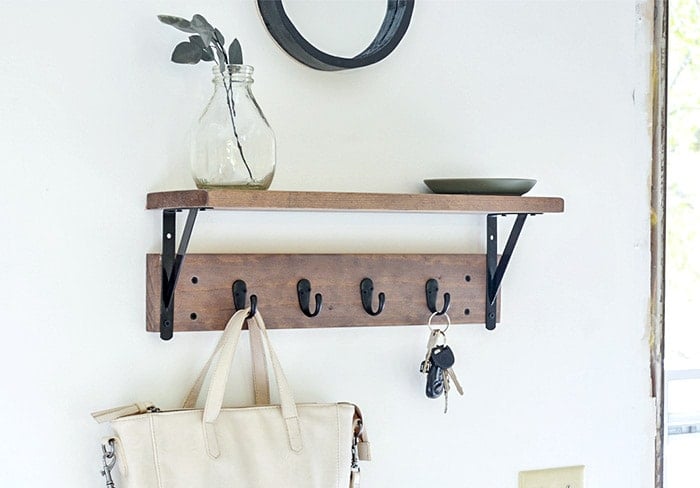 closeup of DIY Entryway shelf with hooks