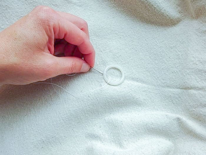 attaching drapery rings to the Roman shade