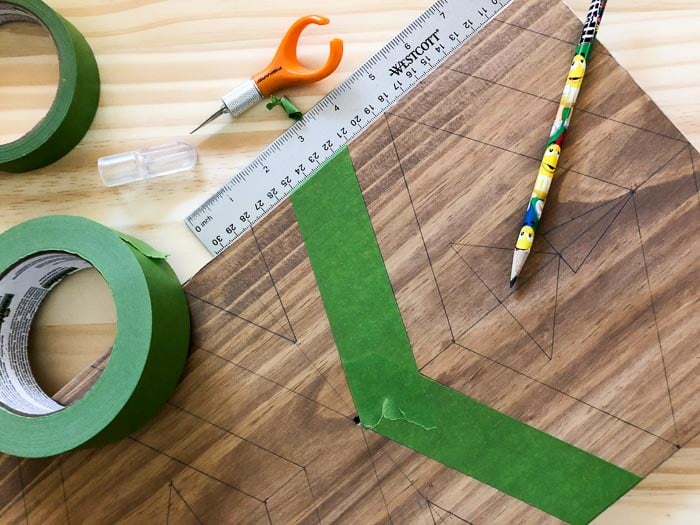 taping a pattern for the Ikea Tarva makeover