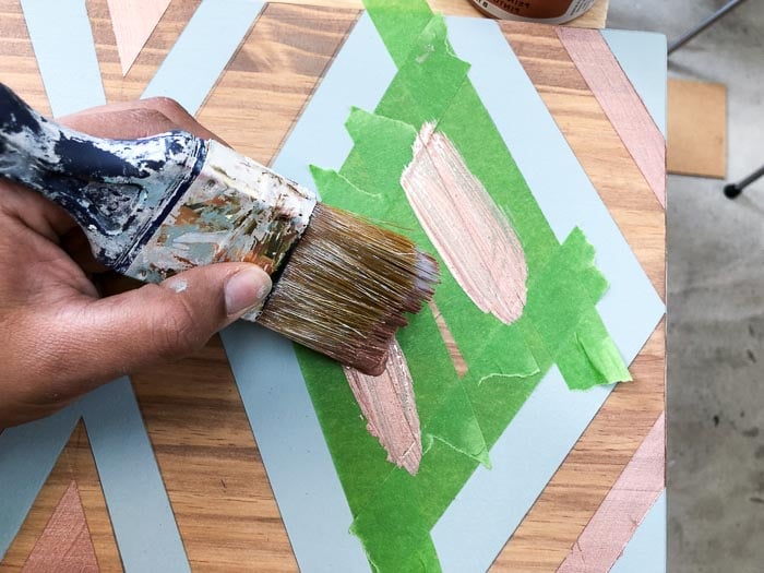 painting metallic lines on the Ikea Tarva!