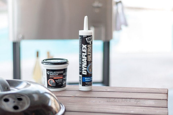 DAP caulking and patching material on grill table