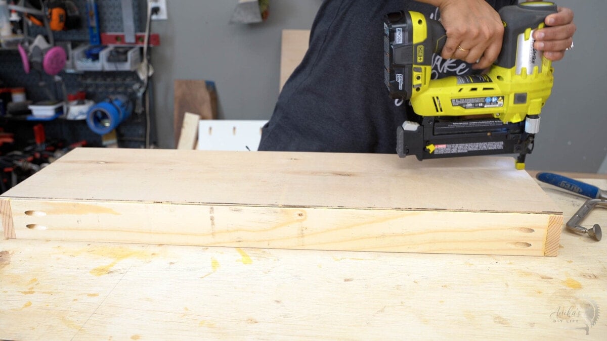 Attaching base of drawer using brad nailer
