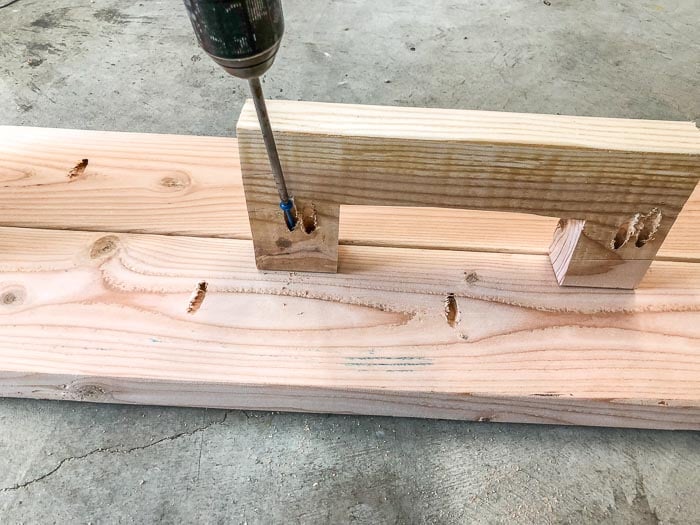 Attaching the center piece of the DIY industrial style bench