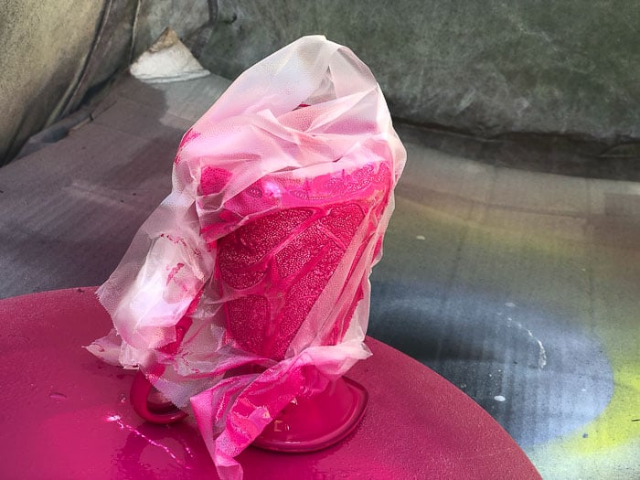 Creating a crackle effect with spray paint by wrapping in plastic wrap.