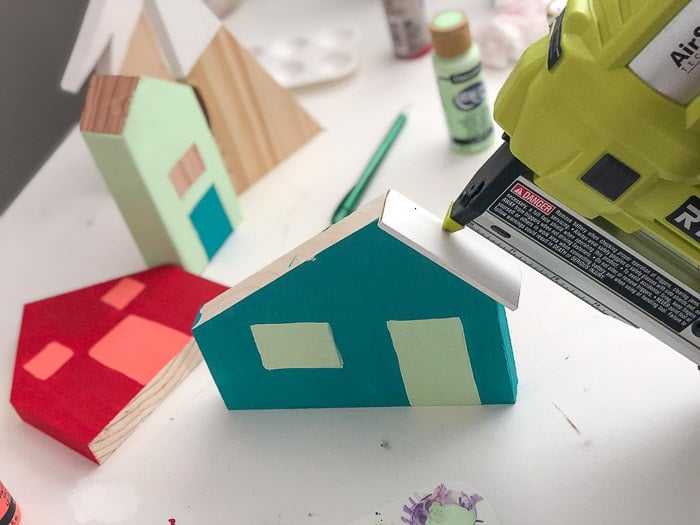 Attaching roof of houses in DIY Christmas village made from Scrap wood using pin nailer