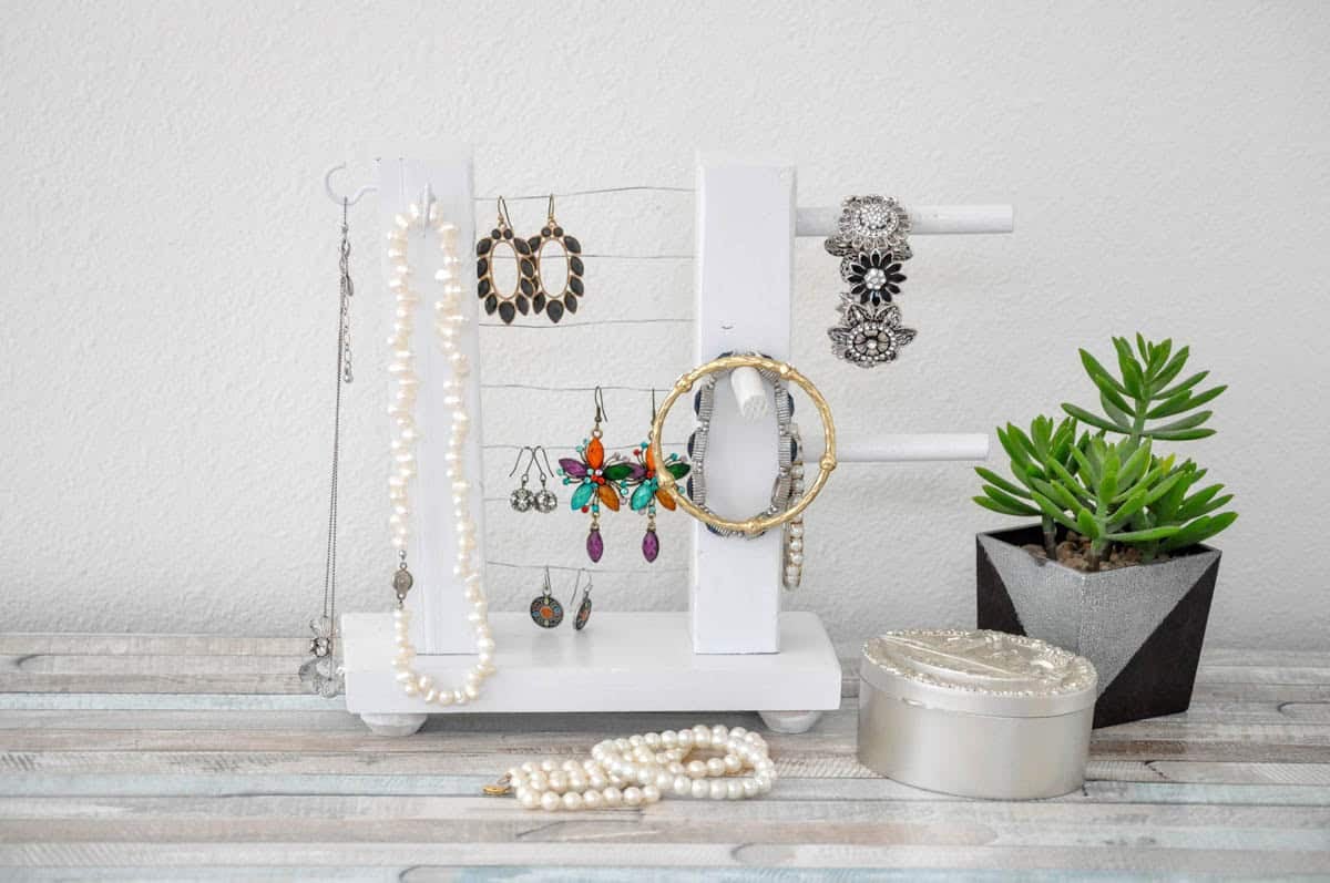 table top jewelry holder painted white with jewelry