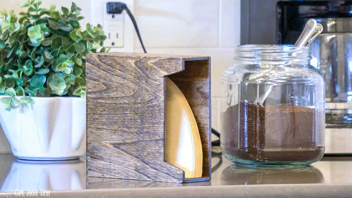 DIY coffee filter holder made from scrap plywood on kitchen counter holding coffee filters